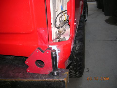 1985 Ford Bronco - prefitting hinge in rr bumper.