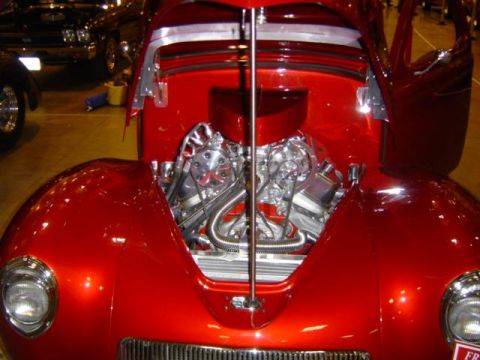 1979 Ford Bronco - Custom hot rod's engine bay is on full display, with chrome accents and polished metal.
