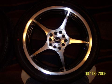 1995 Ford Probe - A close-up of an ADR wheel, a five-spoke design and a polished lip.