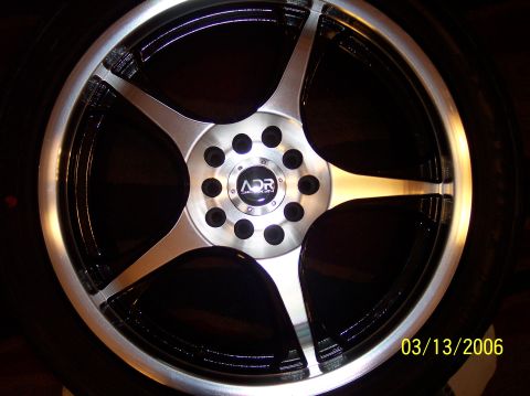 1995 Ford Probe - Close-up of an ADR custom alloy wheel, showing its multi-spoke design and two-tone finish.
