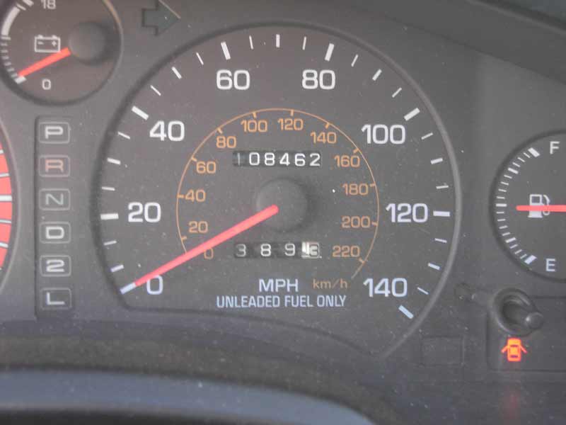Dashboard gauges showing 08462 miles, 3893 miles, and fuel level