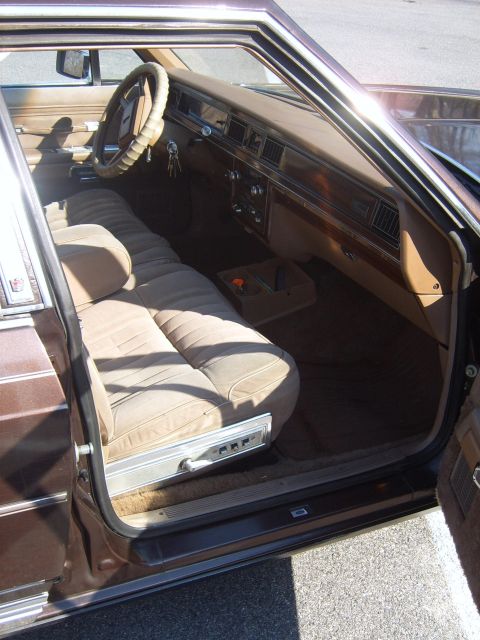1982 Ford Crown Victoria LTD - Interior view of a 1982 Ford Crown Victoria LTD, a bench seat and classic dashboard.