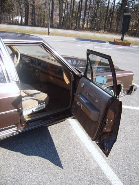 1982 Ford Crown Victoria LTD - Interior view of a 1982 Ford Crown Victoria LTD, showing the driver's seat and door panel.