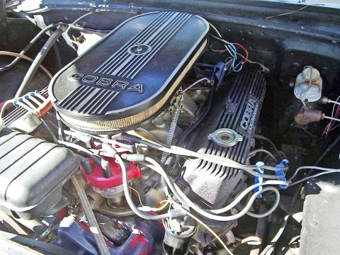 1963 Ford Galaxie - Close-up of an engine bay Cobra valve covers and a Cobra air cleaner assembly.