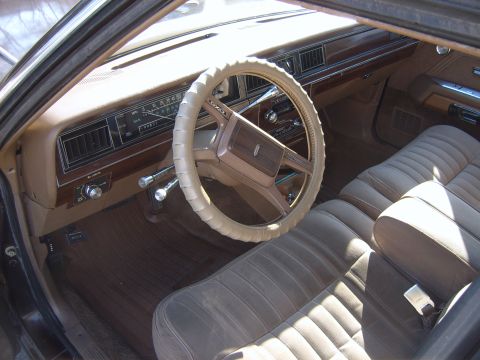 1982 Ford Crown Victoria LTD - Interior view of a 1982 Ford Crown Victoria LTD, highlighting the dashboard and seating.