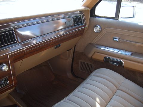 1982 Ford Crown Victoria LTD - Interior view of a 1982 Ford Crown Victoria LTD, tan upholstery and woodgrain accents on the dashboard.