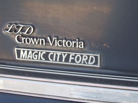 1982 Ford LTD Crown Victoria - Close-up of a vehicle emblem indicating LTD Crown Victoria and Magic City Ford.