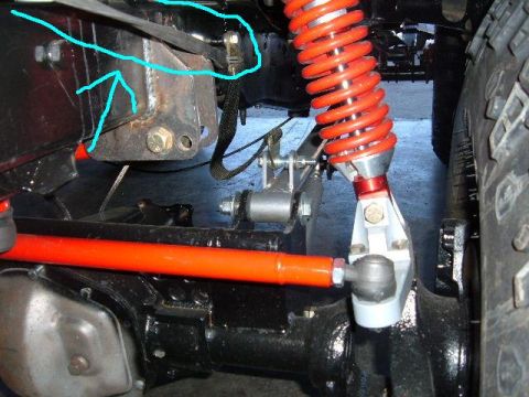 1985 Ford F-150 - Close-up view of custom suspension components on a vehicle chassis, with a visible watermark.