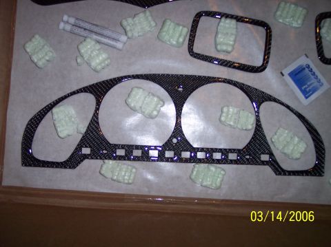 1995 Ford Probe - Carbon fiber trim pieces are laid out on a surface, ready for installation.