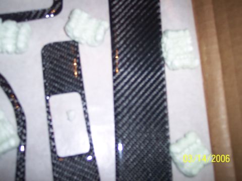 1995 Ford Probe - Carbon fiber trim pieces are shown with white foam packaging, suggesting they are new parts.