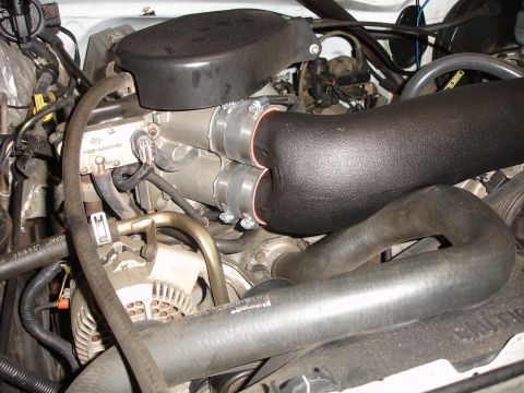 1996 Ford Bronco - Close-up view of a K&N FIPK cold air intake system installed in an engine bay.