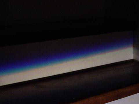 1993 Ford Probe - A close-up of a headlight beam pattern is visible, displaying a spectrum of colors against a dark background.