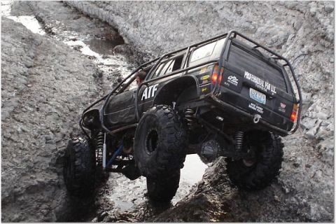 1999 Jeep TJ - This heavily modified Toyota 4Runner tackles a challenging off-road course.