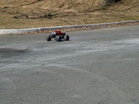 1994 Ford Bronco - Remote control monster truck on a paved road.