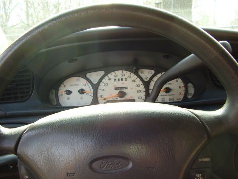 1997 Ford Taurus - The dashboard of a 1997 Ford Taurus displays the odometer reading and various gauges.