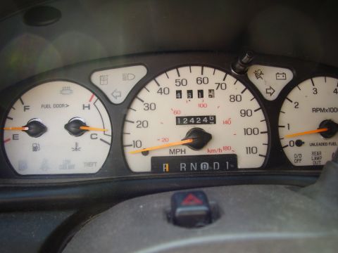 1997 Ford Taurus - The odometer shows 124,245 miles on this vehicle's interior gauges.