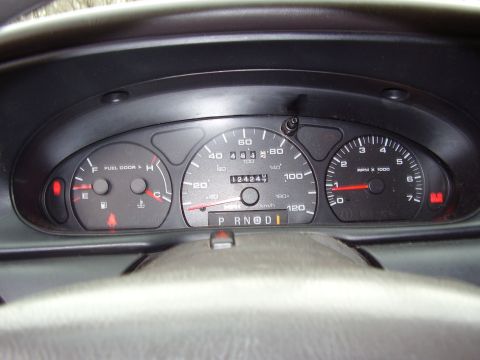 1997 Ford Taurus - Dashboard of a 1997 Ford Taurus, showing odometer reading 124,242 miles and PRNDI gear selection.