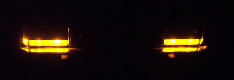 1985 Ford Crown Victoria LTD - Two amber lights are visible against a black background.