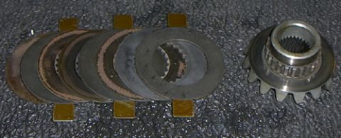 1991 Ford Bronco - Differential clutch pack and ring gear shown on a textured surface.