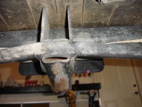 1996 Ford Bronco - Underside view of a tow hitch receiver, showing wear and tear.