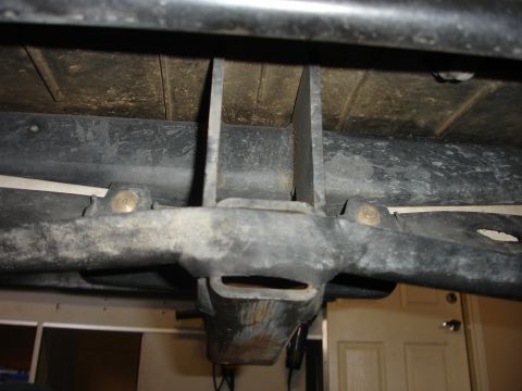 1996 Ford Bronco - Close-up view of the undercarriage, focusing on the tow hitch assembly.