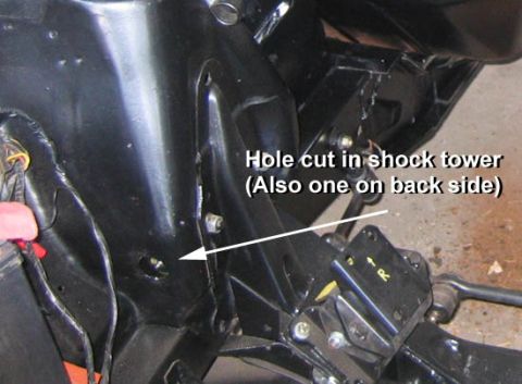 1971 Ford Ranchero - Hole torched in shock tower to access control arm zirc fitting. Installed by previous owner. I would have used a hole saw.