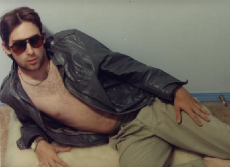 1991 Ford Bronco - A man in a leather jacket and sunglasses poses for a photo.