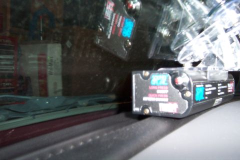 2005 Ford Explorer - Radar detector mounted on the inside of a car's windshield.