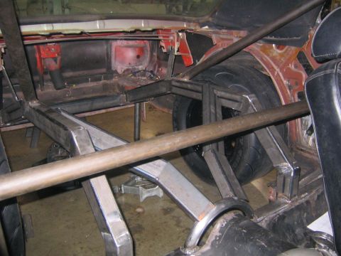 1969 Ford Mustang - Custom roll cage and spare tire installed in the interior of a 1969 Ford Mustang.