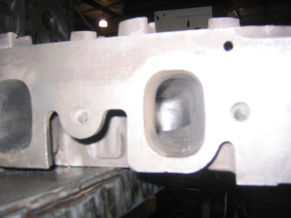 Engine cylinder head with intake and exhaust ports visible