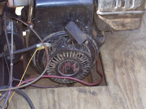 1992 Ford Bronco - This small engine features a pull starter and visible wiring, with '10 HP' marked on the starter housing.