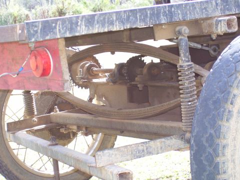 1992 Ford Bronco - The drivetrain and suspension components of a vehicle are visible in this close-up shot.