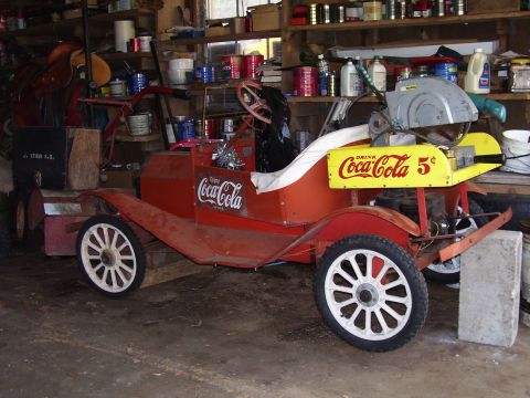1992 Ford Bronco - This vintage-style vehicle is decorated with Coca-Cola advertisements and appears to be a custom build or replica.