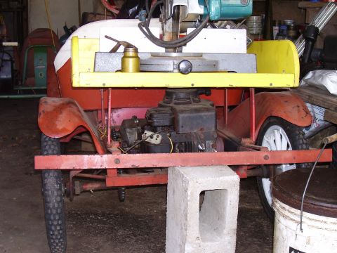 1992 Ford Bronco - Rear view of a custom-built motorized cart with a visible engine and red fenders.