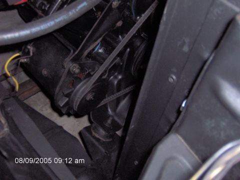 1960 Ford F-100 - Close-up view of engine components, including a belt and pulley system, with a timestamp visible in the lower left corner.