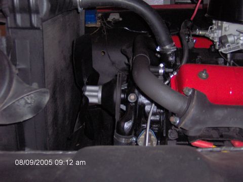 1960 Ford F-100 - Close-up view of an engine bay, focusing on the radiator and hoses.