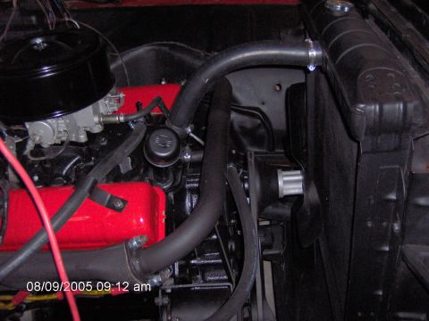 1960 Ford F-100 - Close-up view of the engine compartment of a 1960 Ford F-100, highlighting the V8 engine and cooling system components.