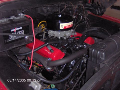 1960 Ford F-100 - Close-up view of a V8 engine bay, the air cleaner assembly and battery, dated 08/14/2005.