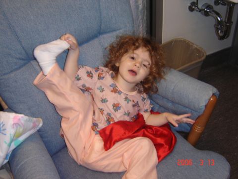 1993 Ford Bronco - A child is sitting in a chair with their legs in an unusual position.