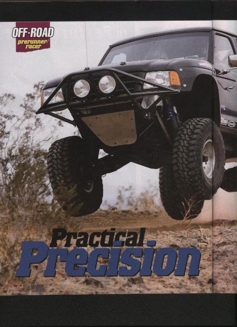 1984 Ford Bronco - This modified 1984 Ford Bronco is shown airborne during an off-road race in a desert environment.
