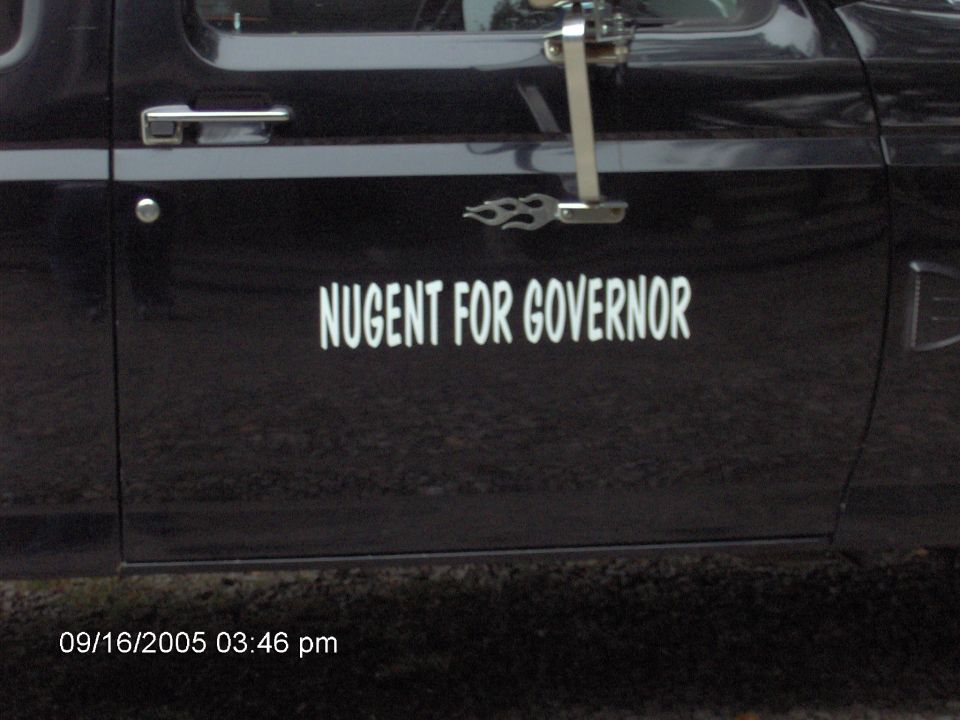 Black pickup door with white NUGENT FOR GOVERNOR lettering and flame billet accent