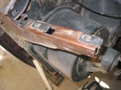 1981 Ford Bronco - Close-up view of a vehicle's mechanical components, focusing on a mounting bracket.
