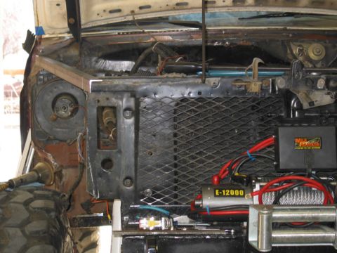 1981 Ford Bronco - Close-up view of the engine bay, showing a winch, radiator, and various electrical components.