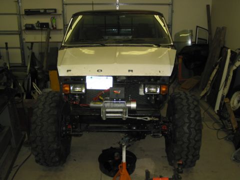 1981 Ford Bronco - This 1981 Ford Bronco features a custom narrowed front end, large off-road tires, and a front-mounted winch.
