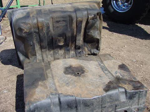 1981 Ford Bronco - This appears to be a gas tank, possibly from a truck or SUV, showing signs of wear and damage.
