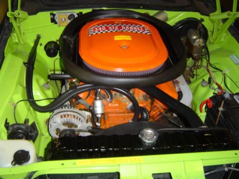 1979 Ford Bronco - The engine bay displays an orange air cleaner with "340 SIX BARREL" text, set against lime green paint and a black radiator.