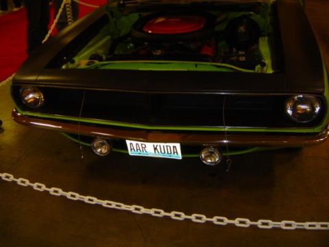 1979 Ford Bronco - This muscle car, possibly a Plymouth Barracuda, is displayed with its hood open, revealing the engine bay.