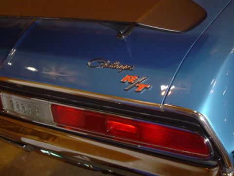 1979 Ford Bronco - Close-up of the rear of a blue 1970 Dodge Challenger R/T, showing the taillight and R/T badging.