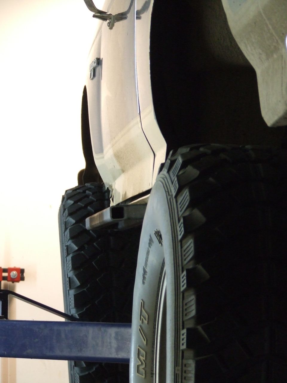 1986 Ford Bronco side view showing large off-road tires and custom rock sliders