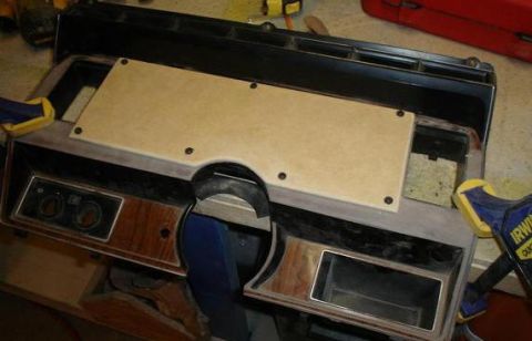 1984 Ford Bronco - A custom dashboard panel is shown with wood grain trim and two circular gauges, possibly for a vehicle restoration project.
